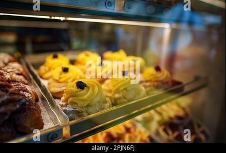 Fresh pastries on display in the store. Stock Photo