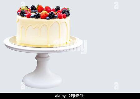 Cheesecake with white chocolate and fresh berries isolated on plain background Stock Photo