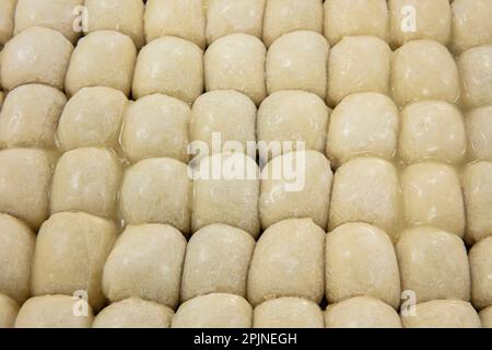 A piece of Bosnian style burek. It is a pastry filled with seasoned meat and onions and baked in an oven. Traditional Bosnian pastry manti borek. Turk Stock Photo
