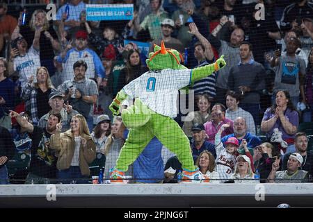 Charlotte Knights mascot Homer the Dragon leads the fans in cheers during  an International League game against the Memphis Redbirds at Truist Field  on April 2, 2023 in Charlotte, North Carolina. (Brian