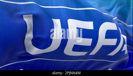 Nyon, CH, September 2022: flag with the UEFA logo waving in the wind. UEFA is the association that manages professional football in Europe. Illustrati Stock Photo