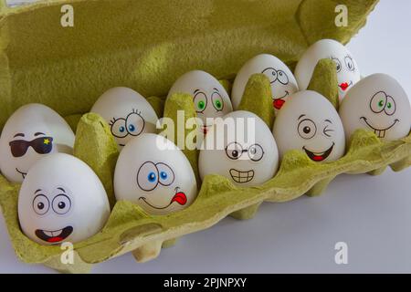 Funny white easter eggs in box Stock Photo