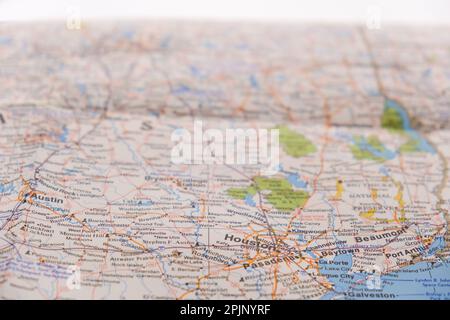 Close up detail of a colorful map focusing on Houston Texas through selective focus, background blur  Stock Photo