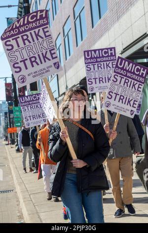 Detroit, Michigan, USA. 3rd Apr, 2023. Graduate student employees at the University of Michigan picket the university's Detroit Center during their strike for a living wage. The 2,000 members of the Graduate Employees Organization/AFT earn $24,000. They are asking for a living wage of $38,500. Credit: Jim West/Alamy Live News Stock Photo