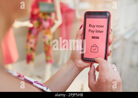 BNPL Buy now pay later online shopping service on smartphone. Online shopping. Paying after delivery. Complete the payment after purchase at no added Stock Photo
