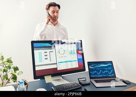 Man entrepreneur having business  conversation on mobile phone. Businessman holding documents and smartphone working with data on charts and graphs in Stock Photo