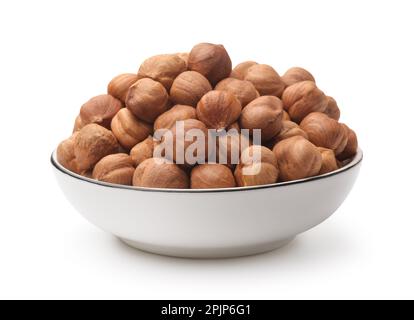 Shelled hazelnut kernels in ceramic bowl isolated on white Stock Photo