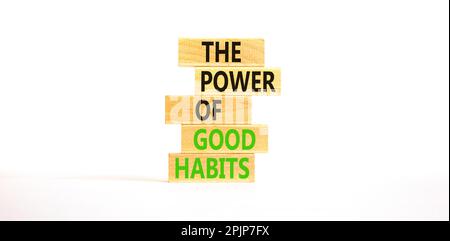 The power of good habits symbol. Concept words The power of good habits on wooden block. Beautiful white table white background. Business the power of Stock Photo