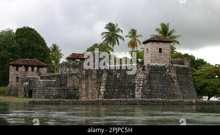 The Castle of San Felipe de Lara is a Spanish colonial fort at the entrance to Lake Izabal in eastern Guatemala. Lake Izabal is connected with the Car Stock Photo