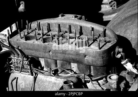 Old rusty engine block without head in black and white Stock Photo