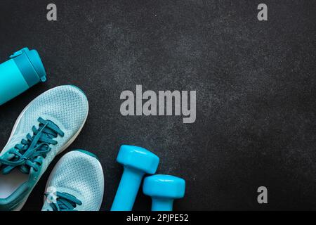 Fitness equipment at black background top view Stock Photo - Alamy