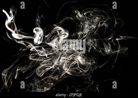 Smoke effect texture. Isolated background. Black and dark backdrop. Smokey fire and mistic effect. Spirit wave. Photo realistic mist stock image. Stock Photo