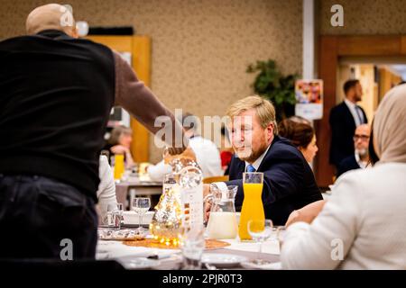 RIJSWIJK - King Willem-Alexander attends an iftar meeting in a community center. Iftar is a meal that is eaten by Muslims immediately after sunset during the fasting month of Ramadan to break the fast. ANP POOL PATRICK VAN KATWIJK netherlands out - belgium out Stock Photo