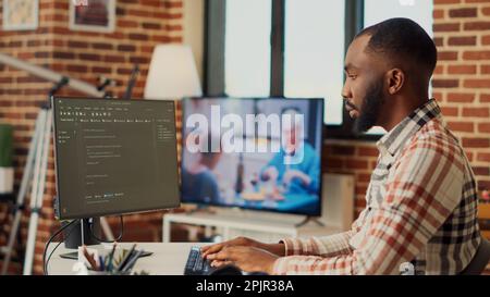 Running Software Developer Freelance software app developer using terminal windows at home ...