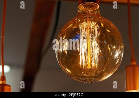 Electric light on bulbs with dark background Stock Photo