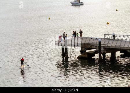 Tourists enjoying at Shoal Bay beach, Port Stephens, Mid North Coast, New South Wales, Australia. Shoal Bay is the most eastern suburb of the Port Ste Stock Photo