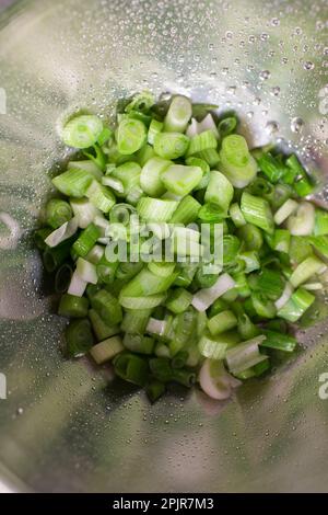 Chopped fresh green onions ready to cook peruvian food Stock Photo