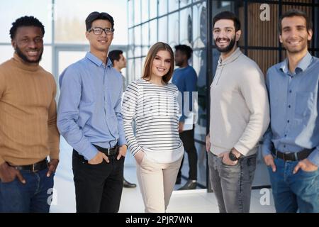 Multiracial business team standing in the office Stock Photo