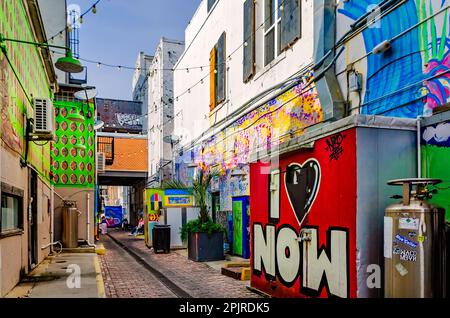 Fishbone Alley is pictured, April 2, 2023, in Gulfport, Mississippi. The brick alley is filled with graffiti and art by local artists. Stock Photo