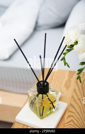 Reed Diffuser With Wooden Sticks In Turquoise Glass Bottle Candles Bouquet  Of Flowers On Table Gray Wall Background Aromatherapy Home Interior Decor  Wellbeing Concept Cozy Atmosphere Stock Photo - Download Image Now 