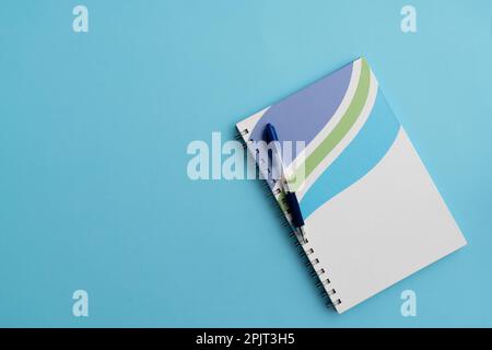 Notebook and pen on the table as a concept of readiness for study and business Stock Photo