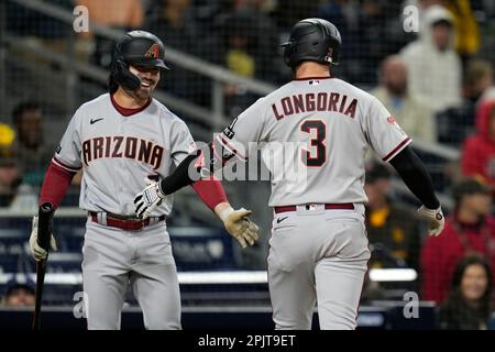 Arizona Diamondbacks' Corbin Carroll is greeted in the dugout after scoring  during the ninth inning of a baseball game against the Detroit Tigers,  Sunday, June 11, 2023, in Detroit. (AP Photo/Carlos Osorio