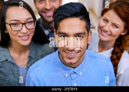 Its all about who you work with. Portrait of a group of young modern professionals. Stock Photo