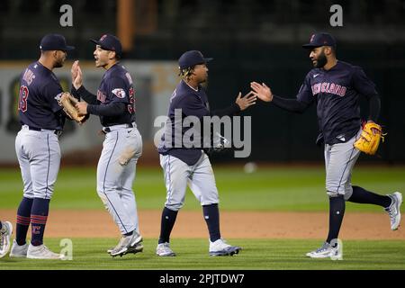 Cleveland Guardians' Amed Rosario (1) and Steven Kwan, right, celebrate  after defeating the Tampa Bay Rays in a wild card baseball playoff game,  Friday, Oct. 7, 2022, in Cleveland. (AP Photo/David Dermer