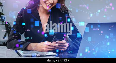 Unrecognizable businesswoman using smartphone and laptop in blurry office with double exposure of immersive blockchain interface. Concept of cryptocur Stock Photo