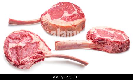 Raw rib steaks with bones or tomahawk steaks isolated on white background. Stock Photo