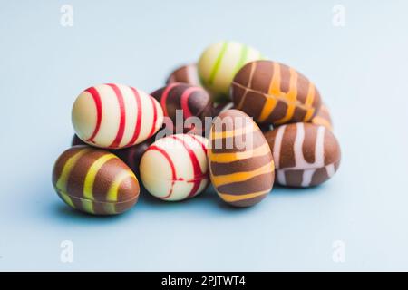 Chocolate easter eggs on the blue background. Stock Photo