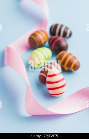 Chocolate easter eggs on the blue background. Stock Photo