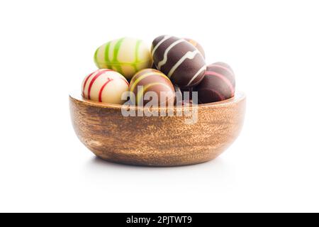 Chocolate easter eggs in bowl isolated on the white background. Stock Photo