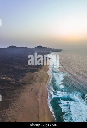 View from above, stunning panoramic view of Cofete beach surrounded by the chain of mountains of the Jandía Natural Park. Fuerteventura, Canary Island Stock Photo