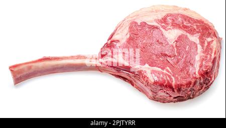 Raw rib steak with bone or tomahawk steak isolated on white background. Stock Photo