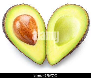 Avocado heart, two halves of an avocado look like a heart shape isolated on white background. Clipping path. Stock Photo