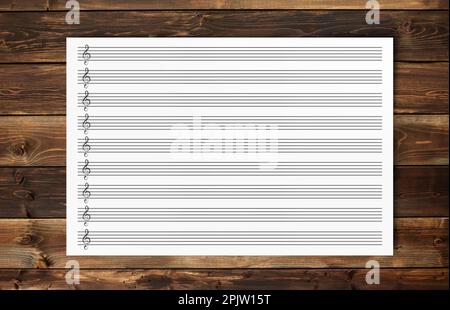 Blank Sheet Music Composition Manuscript Staff  on  wood background Stock Photo