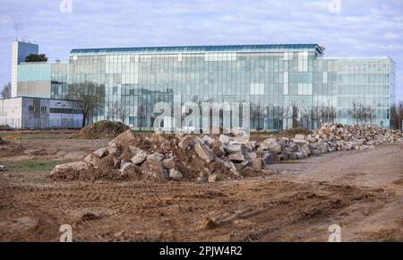 Leipzig, Germany. 04th Apr, 2023. Mountains of rubble lie on a neighboring property of the corporate headquarters of the gas supplier VNG AG. The number three on the German market had run into financial difficulties due to the energy crisis. The lack of Russian gas supplies had to be replaced expensively from other sources. Credit: Jan Woitas/dpa/Alamy Live News Stock Photo