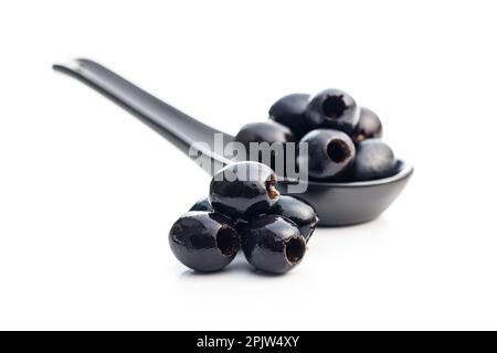 Pitted black olives isolated on the white background. Stock Photo
