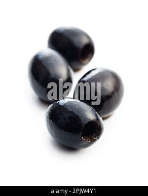 Pitted black olives isolated on the white background. Stock Photo