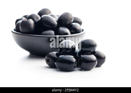 Pitted black olives isolated on the white background. Stock Photo