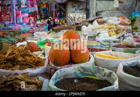 Dried beans, spices and oter goods for sale at a stall in the central market in Pleiku in the central highlands in Vietnam. Stock Photo