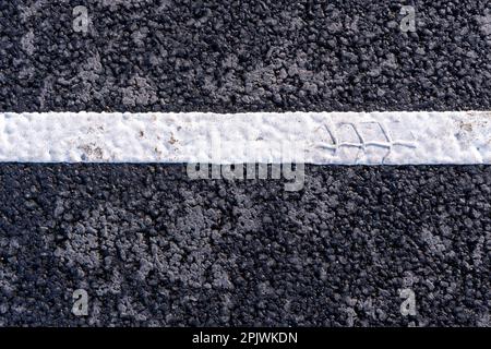 The white dividing line on the road. Road markings. the place of intersection of the road, the rules of the road Stock Photo