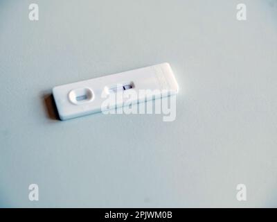 Close up of a rapid test for the diagnosis of covid-19 on a white background. Covid virus infection detection device. Stock Photo
