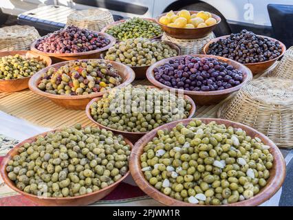 Olives on sale on market stall, Doue, France Stock Photo