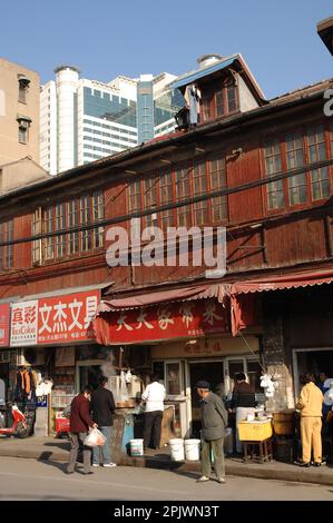 The north-eastern districts of the city of Shanghai: the traditional Shikumen houses surrounded by high-rise buildings. Shanghai, China, Asia Stock Photo