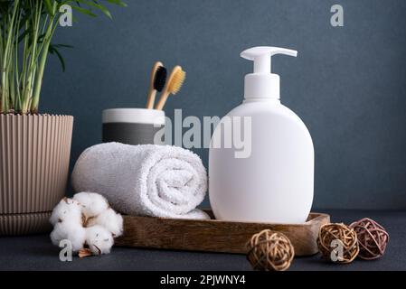 White empty shampoo or lotion bottle for mock-up in modern dark bathroom interior Stock Photo