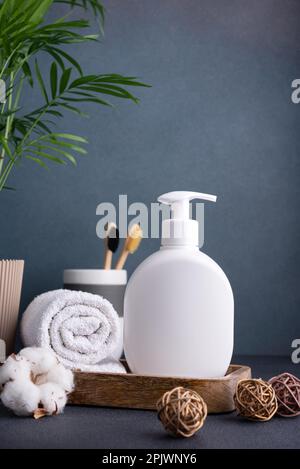 White empty shampoo or lotion bottle for mock-up in modern dark bathroom interior Stock Photo