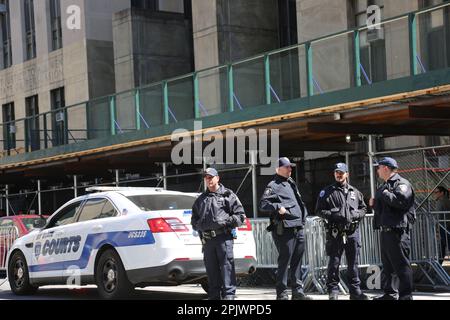 New York, USA. 3rd Apr, 2023. Law enforcement staff are on duty outside the complex of Manhattan Criminal Court and Manhattan District Attorney's Office in New York, the United States, April 3, 2023. New York City further reinforced its security measures ahead of the scheduled arraignment of former U.S. President Donald Trump at a criminal court in Lower Manhattan on Tuesday. Credit: Liu Yanan/Xinhua/Alamy Live News Stock Photo