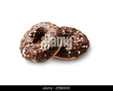 Two donuts in chocolate glaze sprinkled with pieces of white, milk and dark chocolate isolated on a white background. High-calorie junk food. Stock Photo